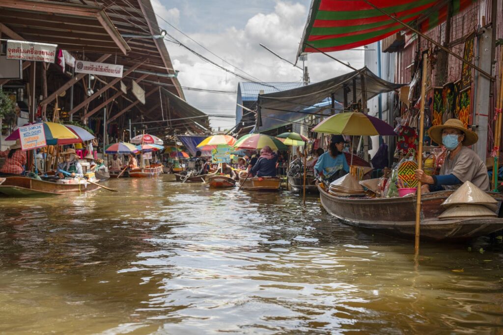 “Markets & Magic: Amphawa Floating Market, Maeklong Railway, and Fireflies Tour”