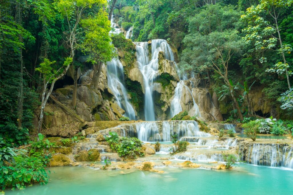 “Serenity and Nature: Alms Giving Experience & Kuang Si Waterfall Adventure”